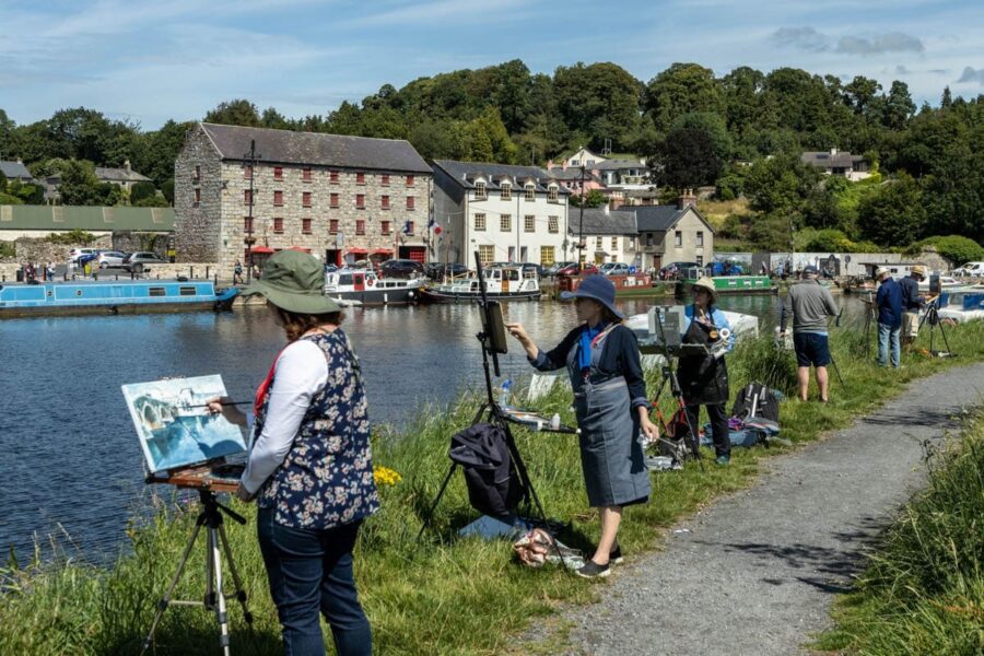 Artists painting together outdoors at a plein air festival